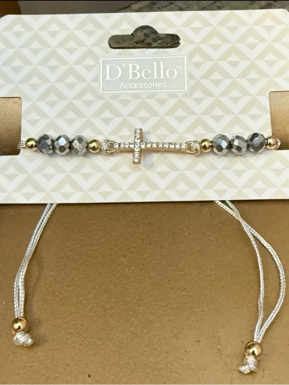 New D'Bello simulated  diamond, gold toned cross with beads bracelet.  Light gra